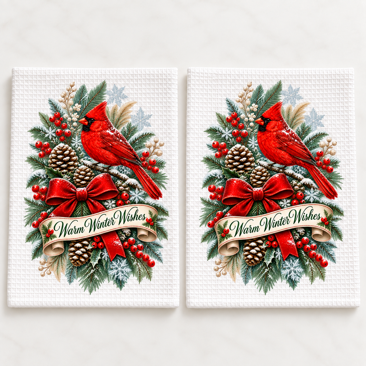 Two white waffle dishcloths with Warm Winter Wishes cardinal design