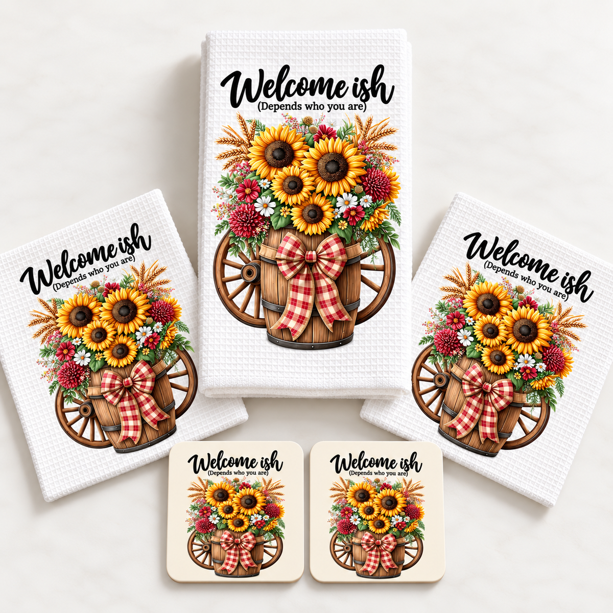 Welcome-ish towel, two dishcloths and two coasters laid out